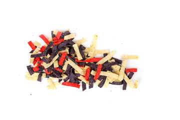 Festive colored tortilla chip strips in red white and blue. Oblong shaped heap  isolated over white. Top down view