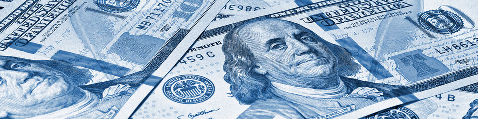 Wall Mural - american paper money. 100 dollar and other us bills. blue tinted banner or header. savings economy a