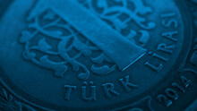 Translation: Turkish Lira. Fragment Of Turkish 1 One Lira Coin Close-up. National Currency Of Turkey. Blue Tinted Money Wallpaper. Background For News About Economy Or Finance. Macro