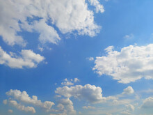 Beautiful Blue Sky With Fluffy White Cumulus Clouds