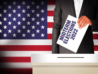 Wall Mural - Midterm Elections 2022 in United States of America with Man holding Voting Paper on the box. Voting and elections concept background