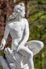 Canvas Print - Old statue of Italian Renaissance and Rococo era young hunter in park of Potsdam, Germany, details, closeup