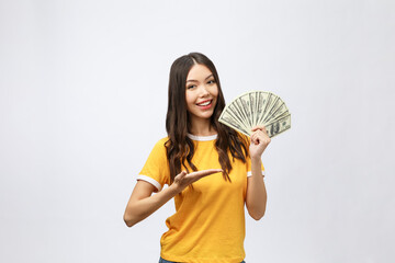 Wall Mural - Closeup portrait of beautiful asian woman holding money isolated on white background. Asian girl counting her salary dollar note. Success wealth financial business cashflow currency payment concept