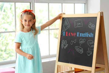 Canvas Print - Cute little girl near chalkboard with text I LOVE ENGLISH