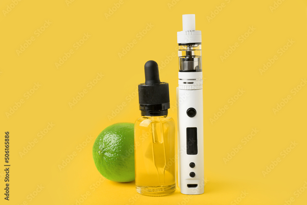 Modern vape mod, oil and lime on yellow background