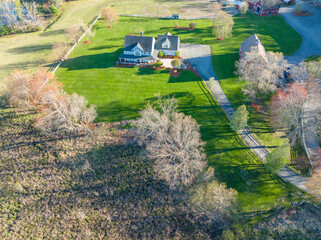Wall Mural - aerial view of farm house in spring sunlight