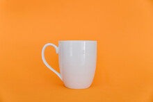 Coffee Cup On An Orange Background