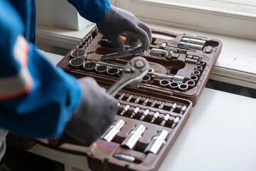 professional worker taking the instrument tool from the toolbox set