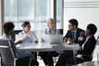 © fizkes - Diverse corporate staff discuss report shown in charts and graphs, analyzing financial stats, do paperwork involved in project analysis during meeting in boardroom. Brainstorming, negotiations concept