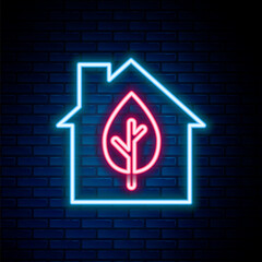 Canvas Print - Glowing neon line Eco friendly house icon isolated on brick wall background. Eco house with leaf. Colorful outline concept. Vector