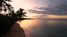 Fiji Tropical Paradise Warm Orange Sunrise Beach Palm Trees - Aerial Footage 