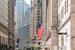 © ImageFlow - New York stock exchange building and wall street. Business and finance