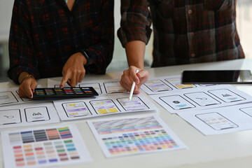 Wall Mural - close up creative ux developer and ui designer brainstorming about mobile app interface wireframe de