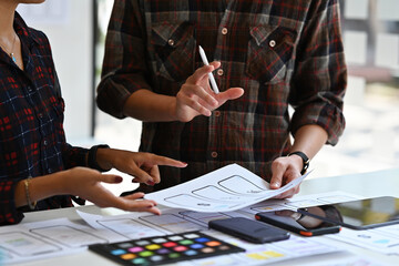 Wall Mural - close up with ux and ui development team discussion about ux and ui mobile app template design, ux u