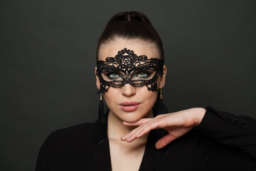 Cute woman in masquerade mask portrait