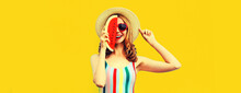 Summer Portrait Of Happy Laughing Cheerful Young Woman With Slice Of Watermelon Covering Her Half Face Wearing Straw Hat On Yellow Background, Blank Copy Space For Advertising Text