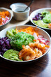 Shrimp Poke Bowl with Seaweed, Avocado, Cucumber, Radish, Cabbage, Sesame Seeds and Teriyaki Sauce