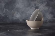 Two Ceramic Bowls Isolated On Gray Background. 