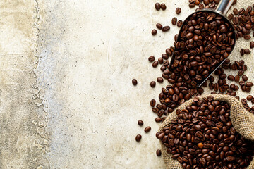 Wall Mural - Coffee background over light rough concrete texture. Old burlap sack bag and metal spoon with dark roasted grains. Tabletop with empty copy space for advertising text