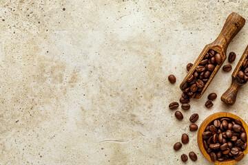 Wall Mural - Coffee composition with copy space concrete background. Rough light stone wall texture with empty space and wooden spoon, bowl with fresh roasted beans and several scattered seeds