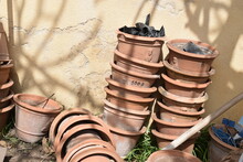 Brown Gardening Pots Piled Outdoors