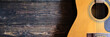 © AREE - banner of acoustic guitar on the wooden background music template concept.