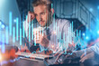 © VideoFlow - Two colleagues in formal wear working together to optimize trading strategy at corporate finance fund. Forex chart hologram over modern office background