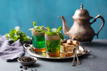 Moroccan Mint Tea In Traditional Glasses On Silver Tray. Grey And Blue Background. Copy Space.