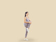 Happy healthy beautiful woman in comfortable sports clothes having fitness workout. Fit young lady in lilac crop top and yoga pants standing isolated on beige background and doing high knee exercise