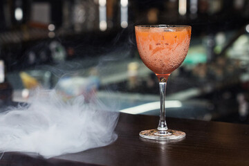 orange cocktail with smoke