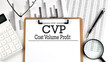 © Iryna - Paper with CVP Cost Volume Profit on a chart with calculator,pen and magnifier