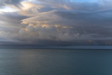 Wall Mural - dramatic sky over the sea at sunrise