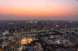 © Westend61 - Egypt, Cairo, Elevated view of Gezira, Agouza, Dokki and Mohandeseen districts at dusk with sporting clubs in foreground
