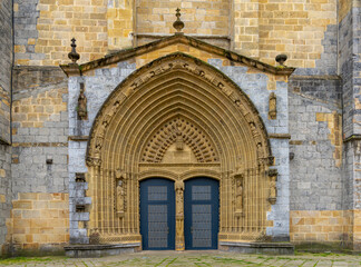 Wall Mural - view of the architectural detail of the door of the Santa Maria Church in the historic city center of Guernica