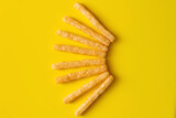Fototapeta Kawa jest smaczna - flat lay of delicious and crispy french fries on yellow