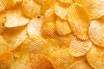 Sticker - bunch of wavy and salty potato chips, top view