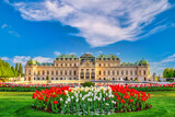 Fototapeta Tulipany - Vienna Austria city skyline at Belvedere Palace and beautiful tulip flower