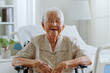 Portrait happy Asian senior woman 90s look at camera, smile and laugh at nursing home