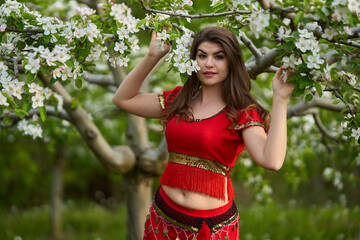 Sticker - Young woman in apple orchard in indian costume