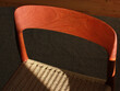 © StudioKomplex - A danish mid century modern teak chair from the 60s vintage standing in the dining living room with paper cord seat teak wood 50s 70s retro original isolated on refurbished in living room closeup loft