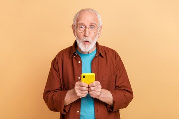 Poster - Photo of impressed granddad see many likes reposts on his post in social network isolated on beige color background