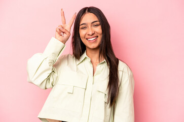 young hispanic woman isolated on pink background showing number two with fingers.