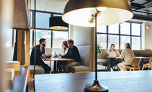 Businesspeople Working In A Modern Co-working Space