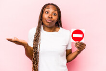 Young African American Woman Holding A Forbidden Sign Isolated On Pink Background
