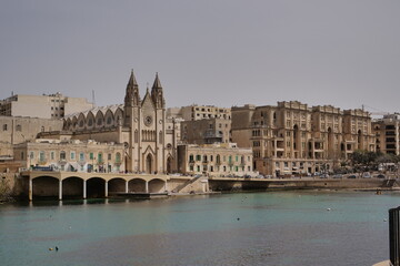 Wall Mural - skyline of St Julians, Malta with the knisja tal-karmnu church on a sunny day