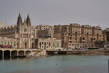 Wall Mural - skyline of St Julians, Malta with the knisja tal-karmnu church on a sunny day