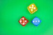 © Paul - Gambling color dice on green casino style background