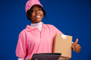 Portrait of Happy African American delivery woman holding a box package