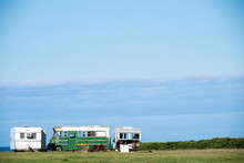Old Abandoned Caravans And Bus On Farmland