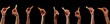 Some Hands with french fries in a row with mayonnaise and ketchup on black background